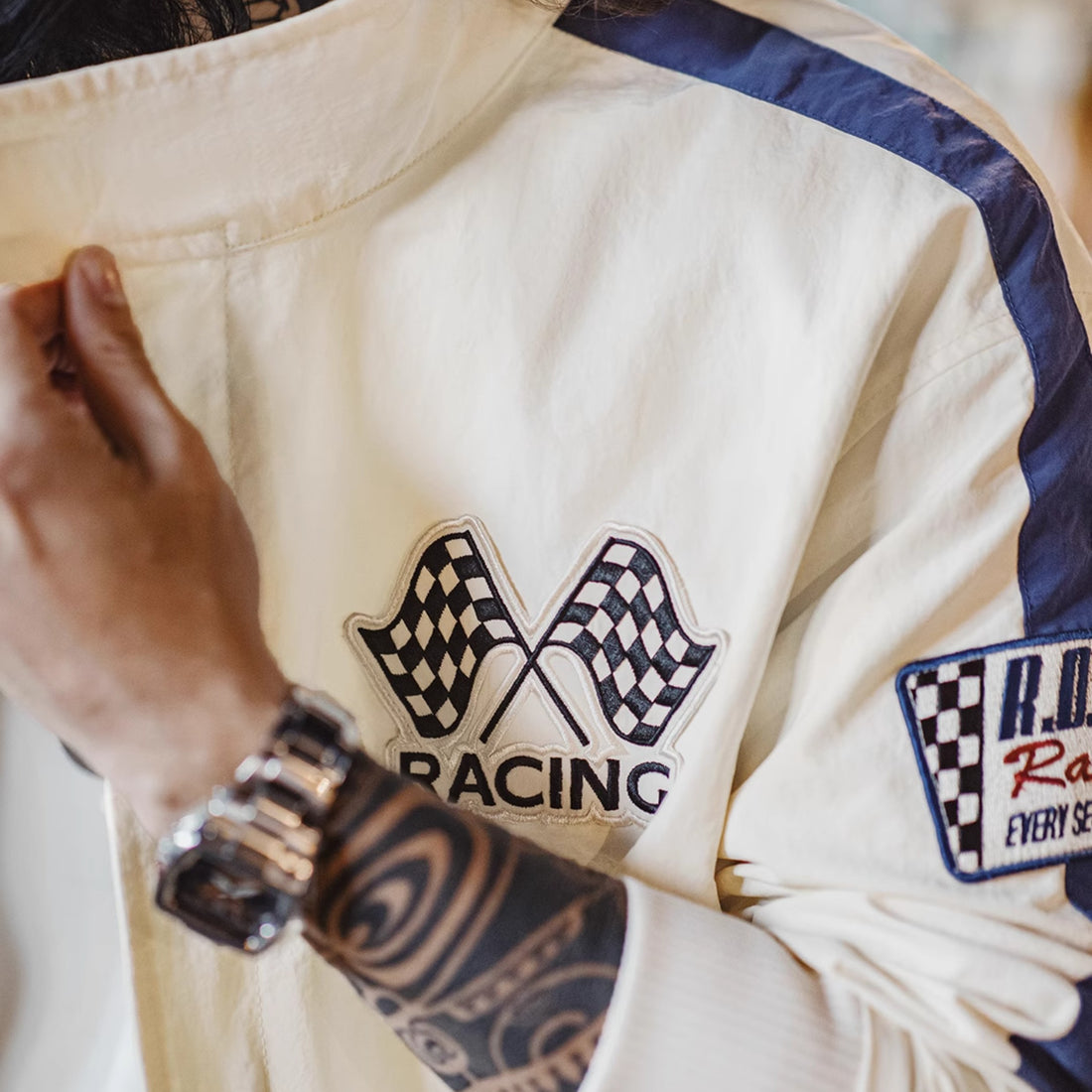Retro racing jacket with a zipper front and long sleeves